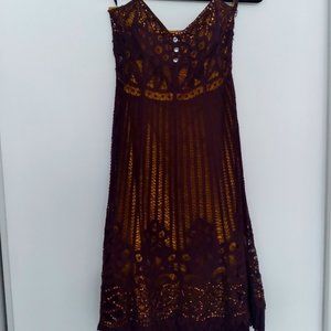 A fancy Betsey Johnson burgundy sleeveless cocktail dress.